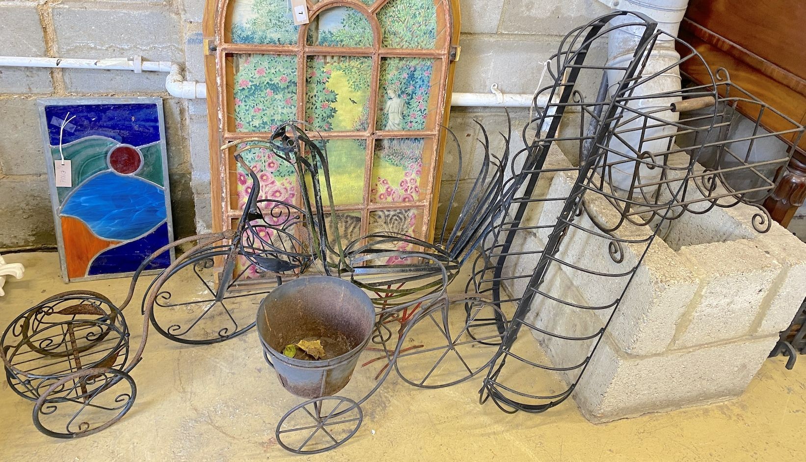 Three wirework garden planters, bird ornament, paper rack and two stained glass panels